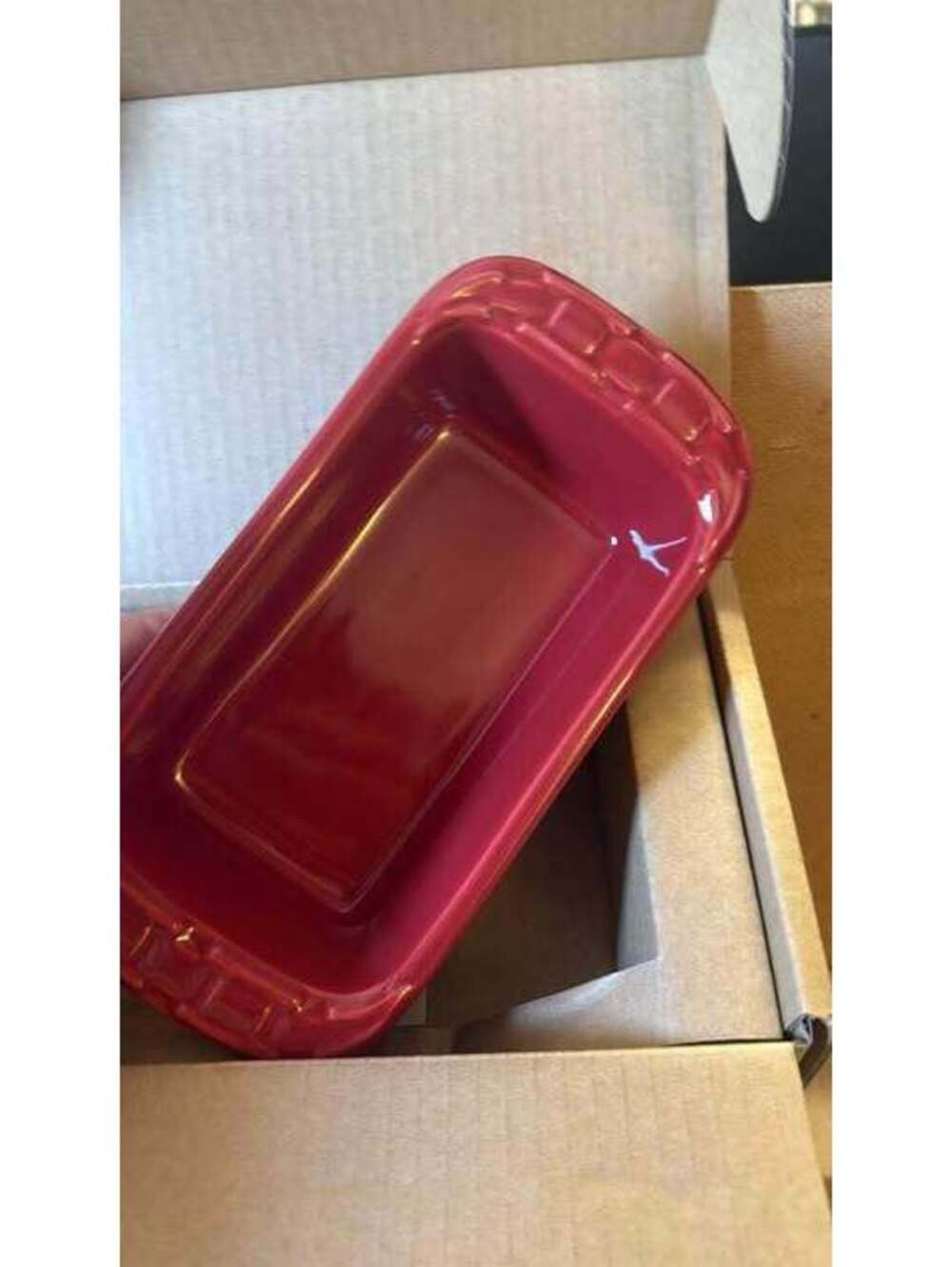red ceramic bakeware is a Longaberger Woven Traditions Mini Loaf Pan